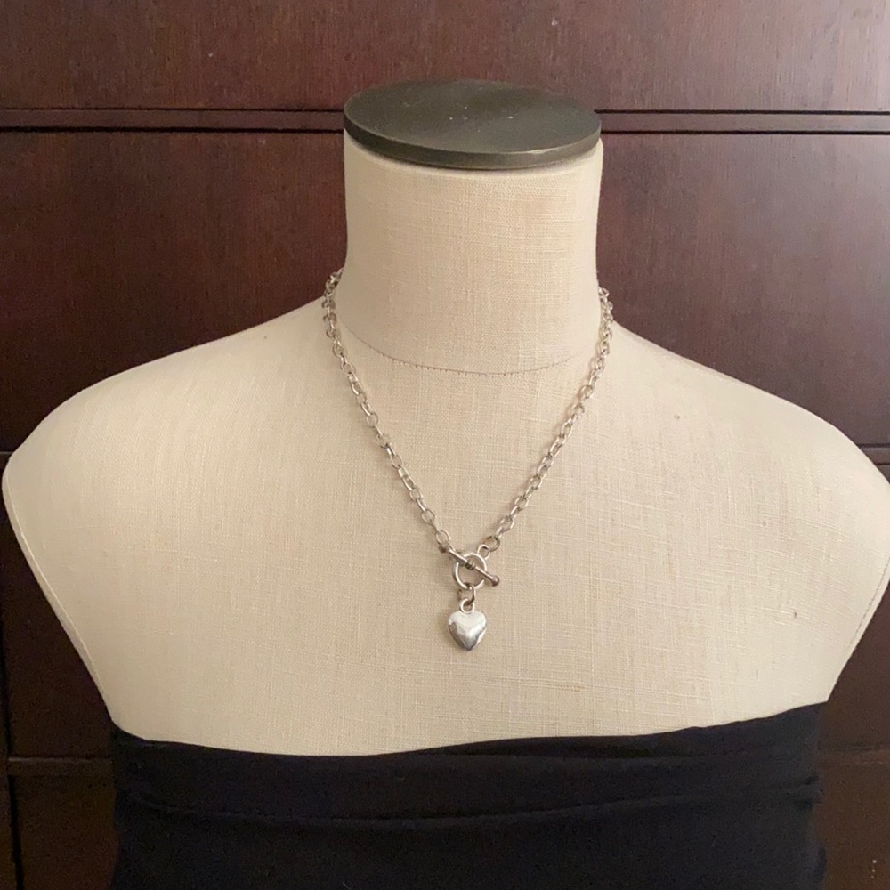 Silver heart necklace with bar and loop enclosure